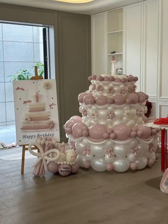 Elegant pink birthday cake balloon setup