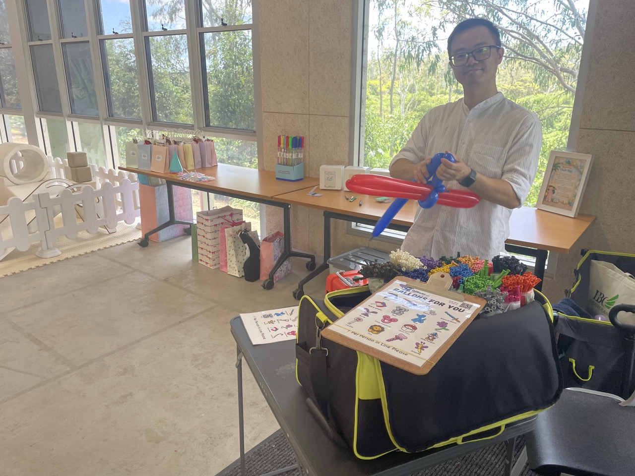 QiBear balloon twisting setup at an event in Brisbane